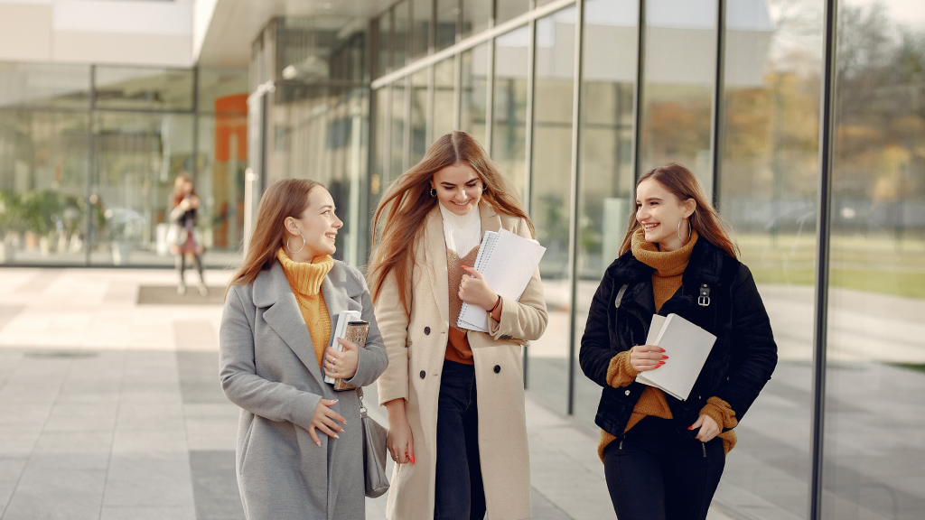 Women walking together at a founder workshop
